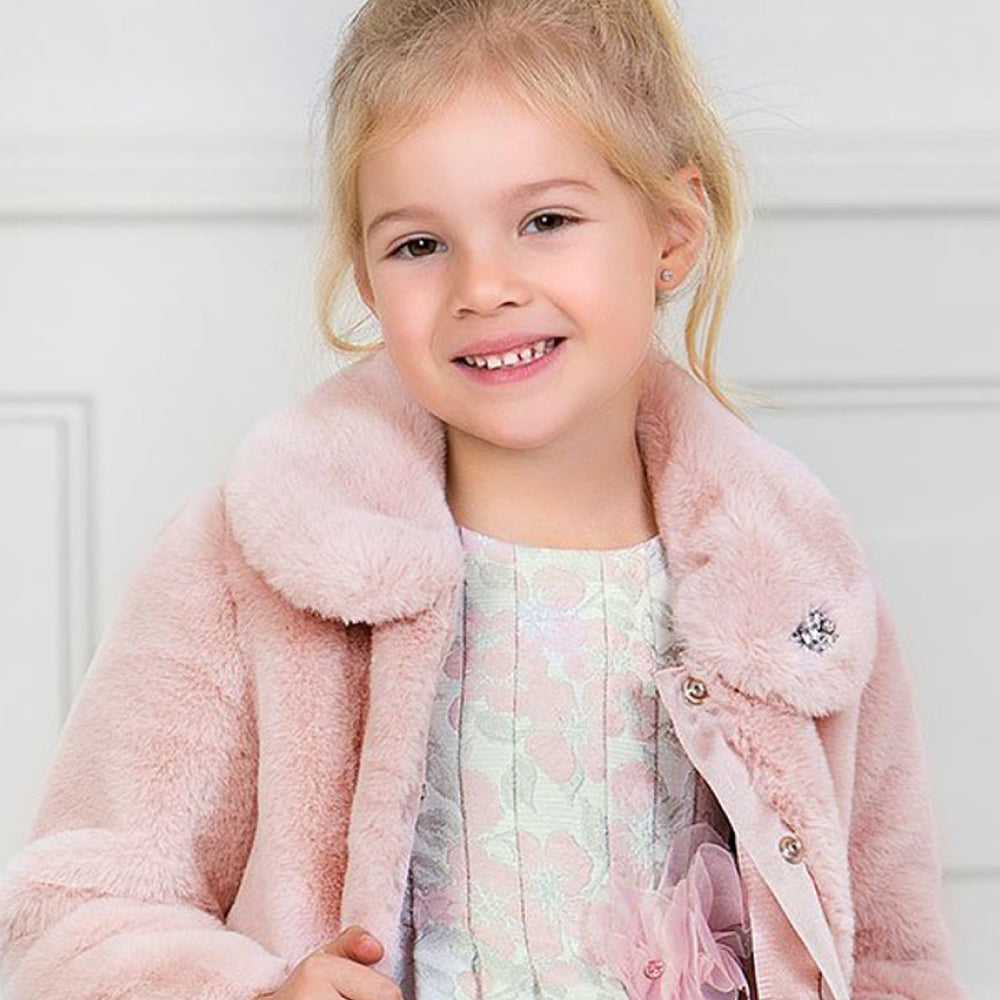 Girl in Pink Jacket Smiling - Brands Section