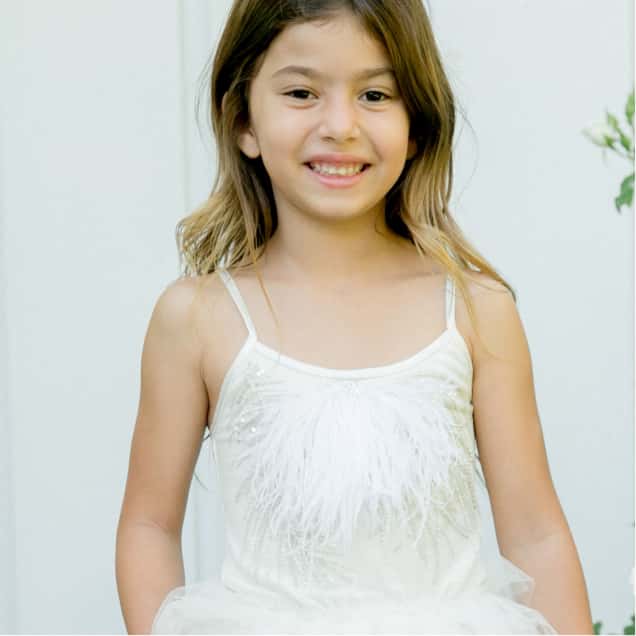 Girl in White Dress Smiling - Her Category