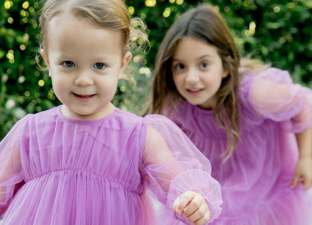 Toddler and Girl in Matching Purple Dresses - How It Works Mobile Banner
