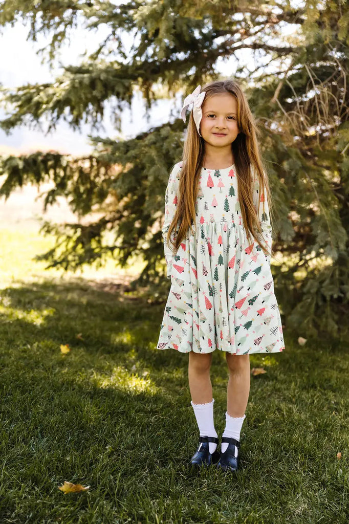 Little Girl standing on the grass.