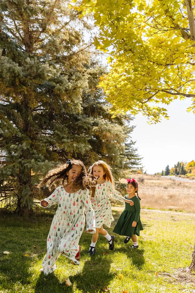 Three Little Girls playing with each other.