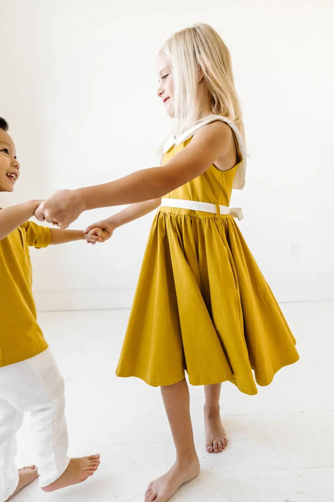 Two little kids dancing.