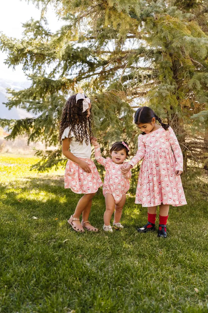 Three Girls wearing same print outfits.