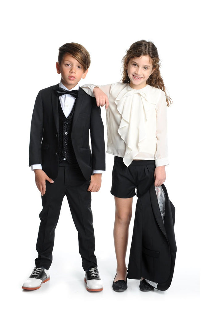Girl and Boy Wearing Tuxedo's 
