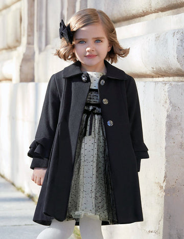 Little Girl Outside Wearing Black Coat