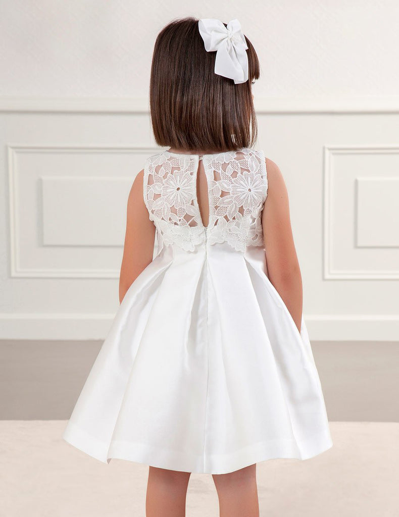 Little Girl with Her Back to the Camera Showing the Whole Back of the Dress