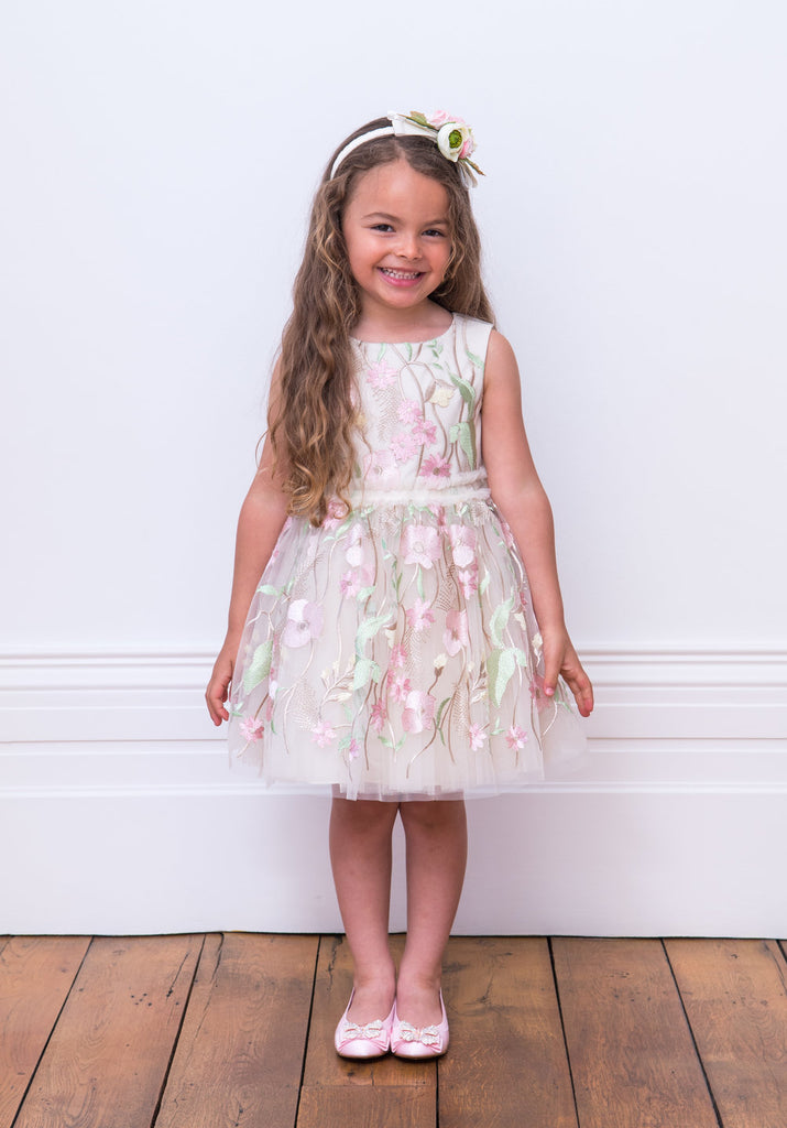 Little Girl posing in wearing David Charles Floral Dress