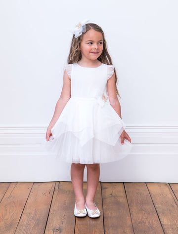 Little Girl wearing David Charles Ivory Butterfly Bridesmaid Gown.