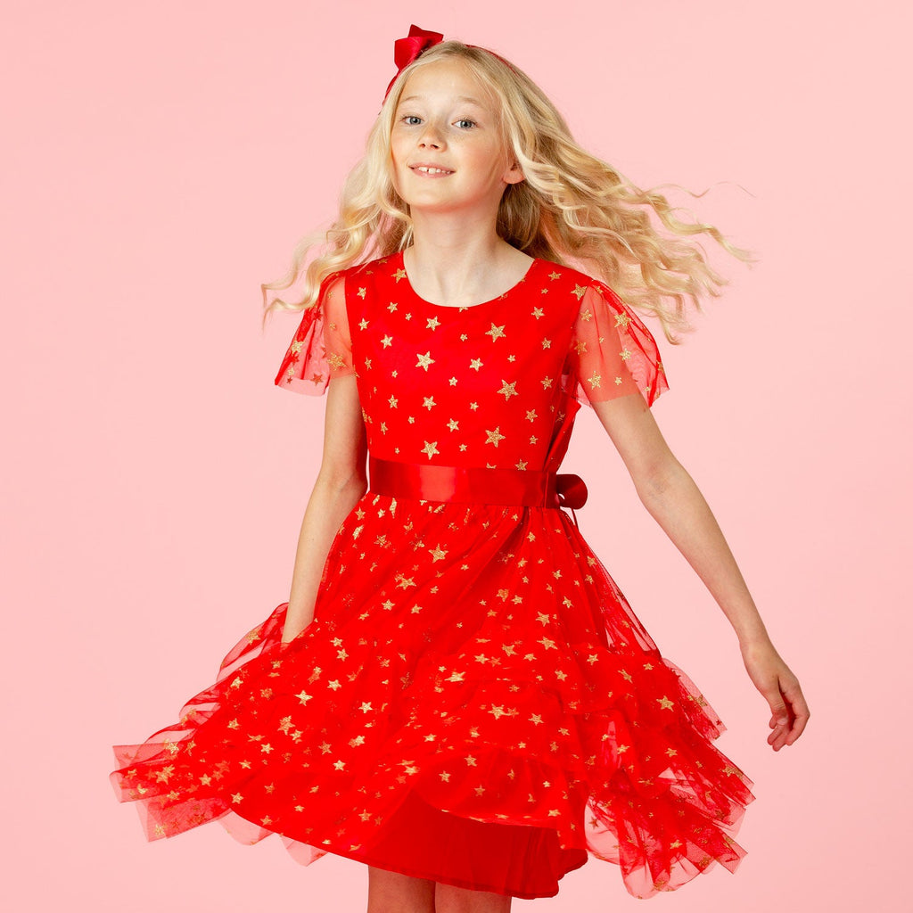Girl Twirling in Cinderella Red- Star Tulle Dress.