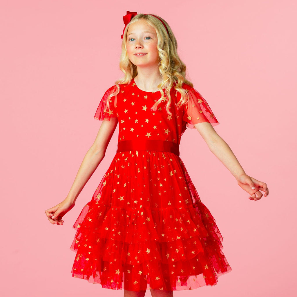Girl wearing a Cinderella Red- Star Tulle Dress.