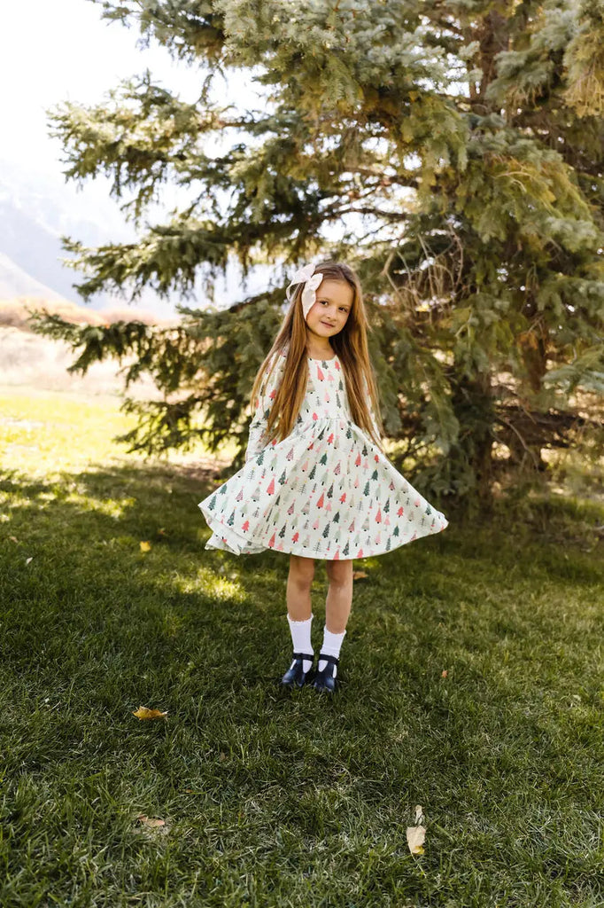 Little Girl showing her Gwendolyn Green Christmas Dress 
